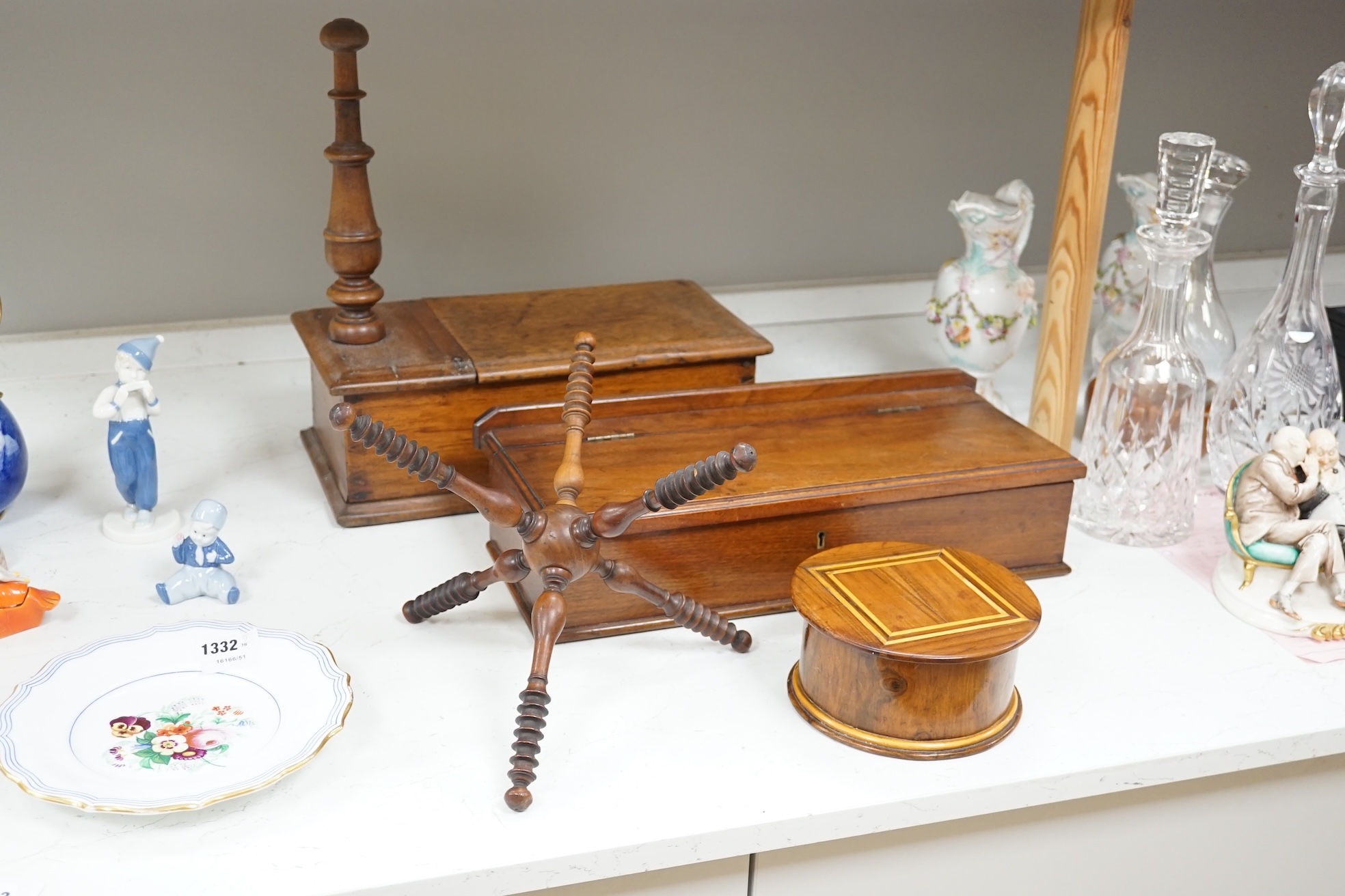 19th/early 20th century woodenware to include Pitcairn Islands circular box and treen ‘cat’ or plate stand, largest 44cm wide. Condition - fair to good